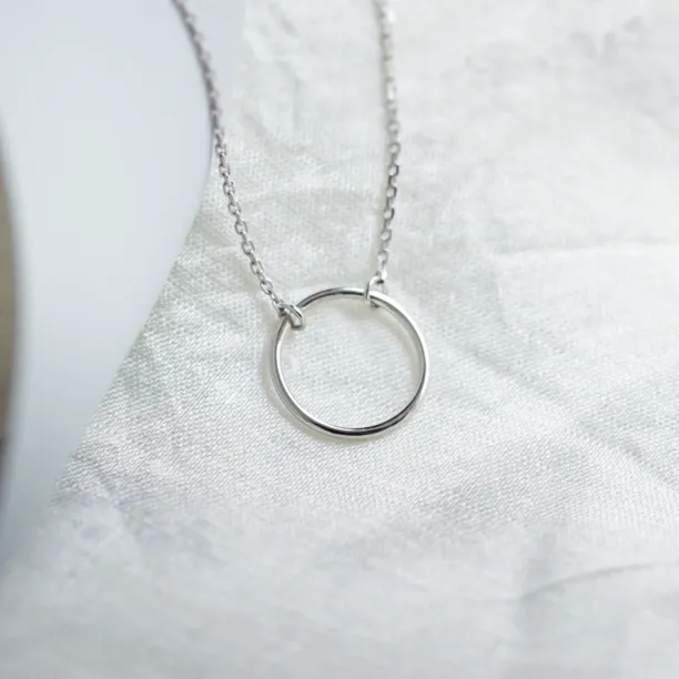 Gold minimalist necklace with a circle KARMA Image
