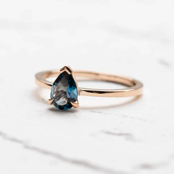 Gold ring with london blue topaz DROP Image