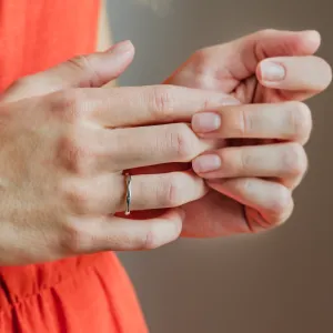 Wavy gold wedding rings with a diamond APRILIA