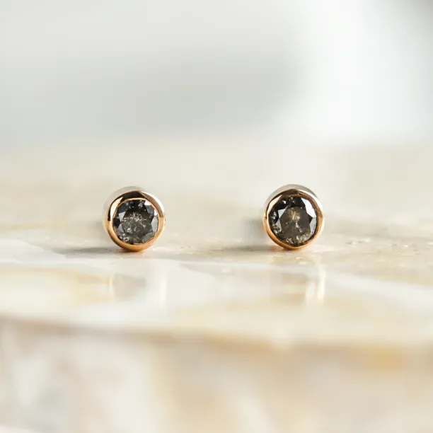 Minimalist gold earrings with salt and pepper diamonds in bezel setting NOLA Image