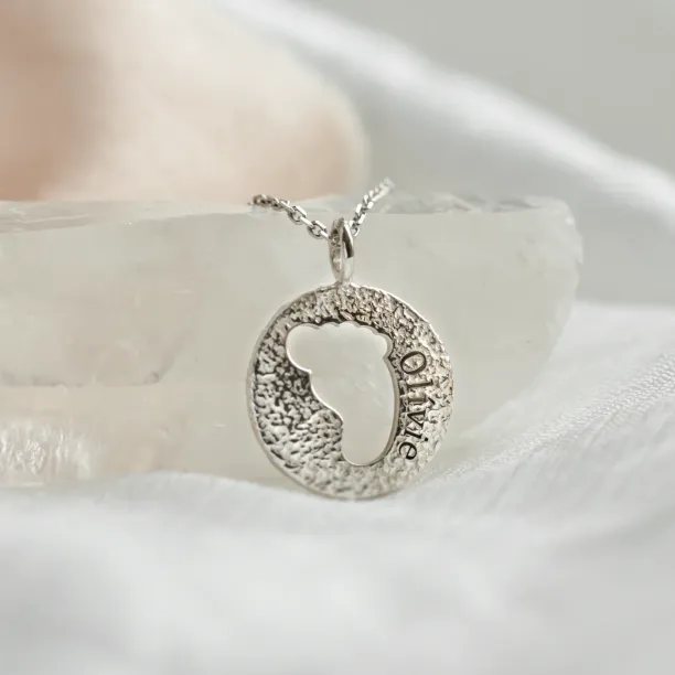 Gold necklace with unusual surface and baby foot trace LEE Image