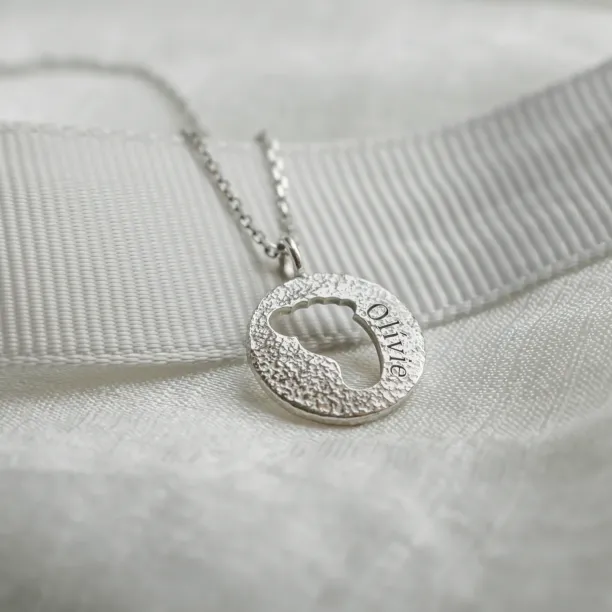Gold necklace with unusual surface and baby foot trace LEE Image