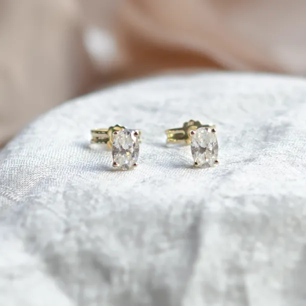 Gold minimalist earrings with oval moissanites CAROLYNE Image