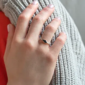 Ring with hammered surface and salt and pepper diamond DART