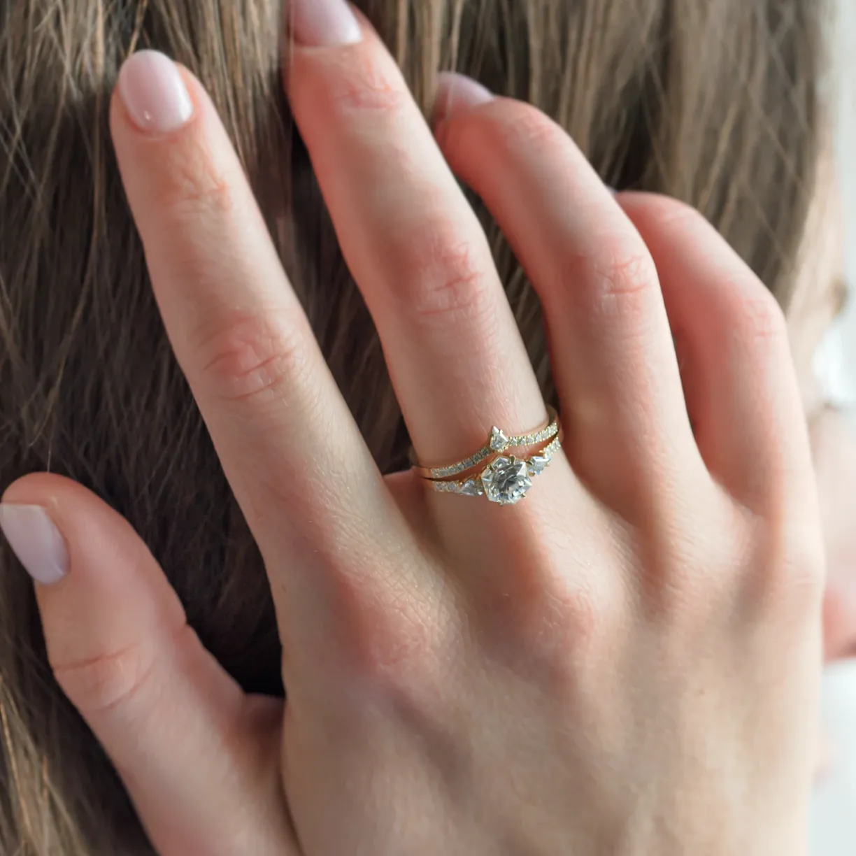 curved_gold_wedding_ring_with_engagement_ring