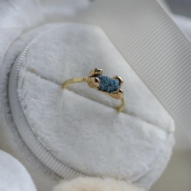 Gold ring with blue raw diamond and hammered surface SEA Image