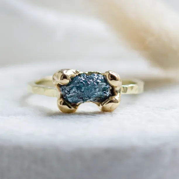 Gold ring with blue raw diamond and hammered surface SEA Image