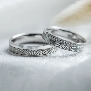 Original wedding rings with relief and diamonds PEACOCK