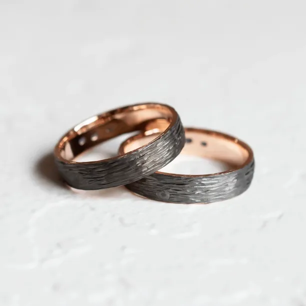 Black wedding rings with woodbark surface EBEN Image