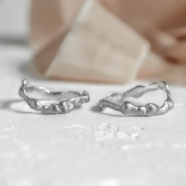 Curved gold wedding rings ZINC Image