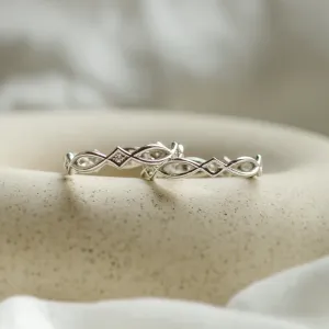 Netradiční snubní prsten s propletením TARANIS Thumbnail