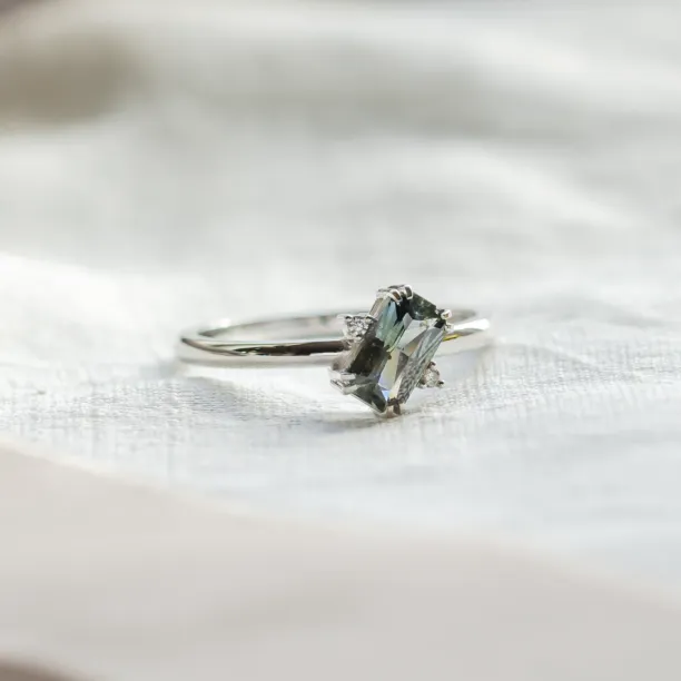 Gold ring with radiant teal sapphire and side diamonds JOY Image