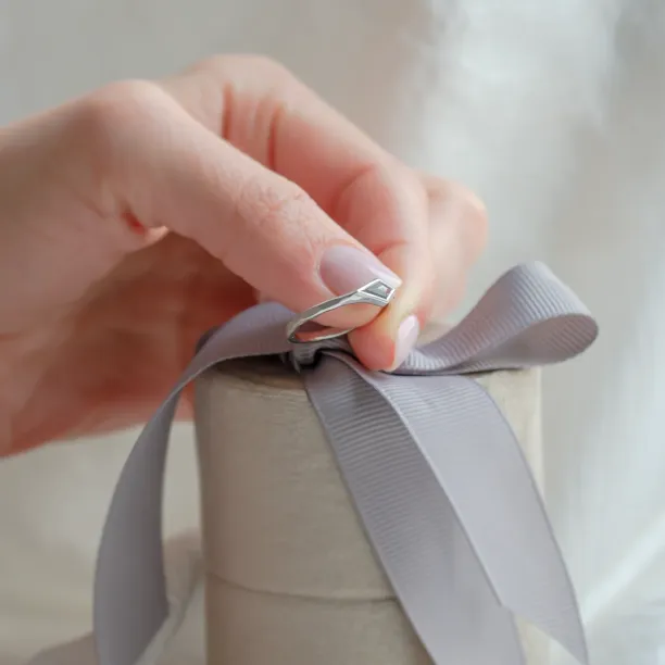 Ring with hammered surface and salt and pepper diamond DART Image