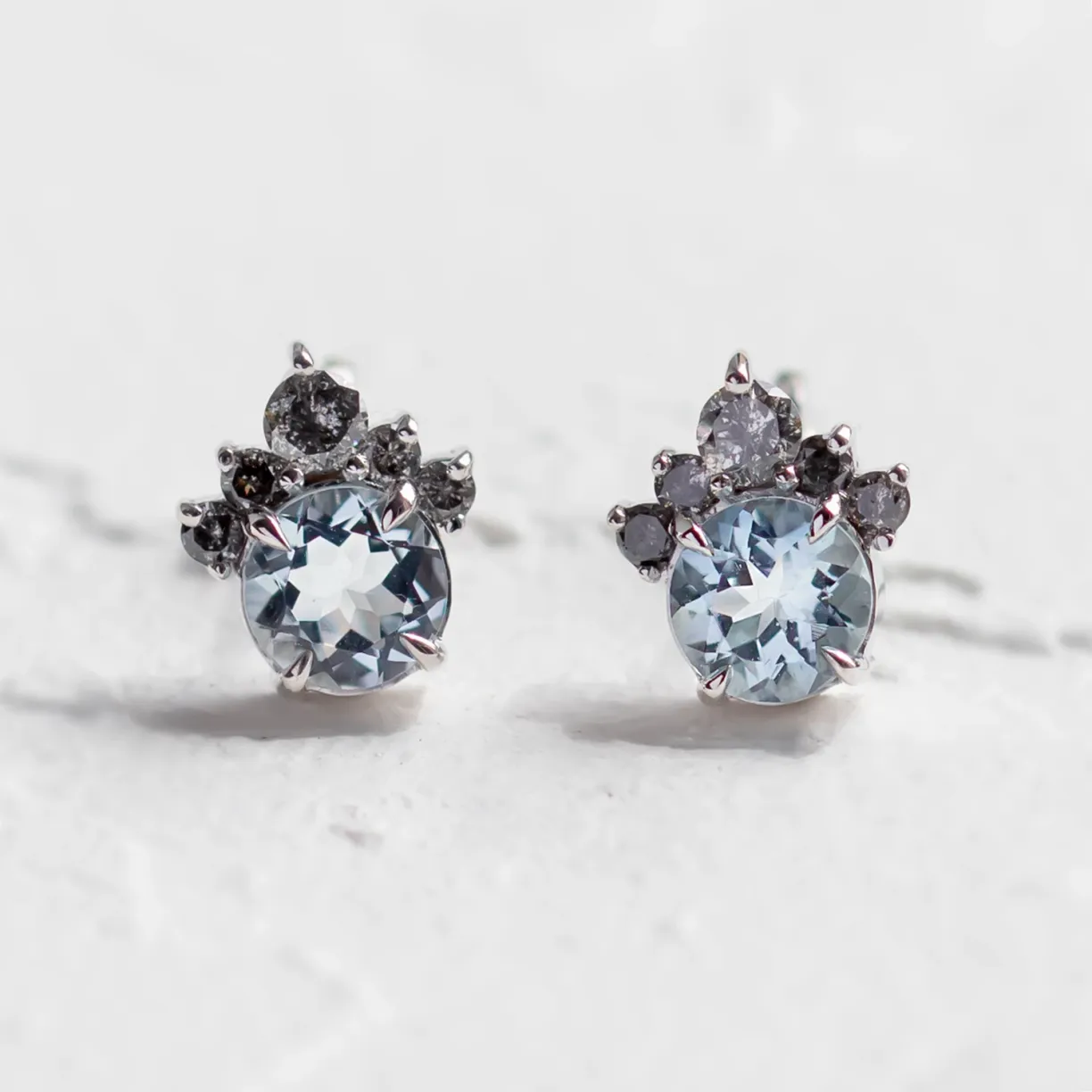 Gold aquamarine and salt & pepper diamond earrings.