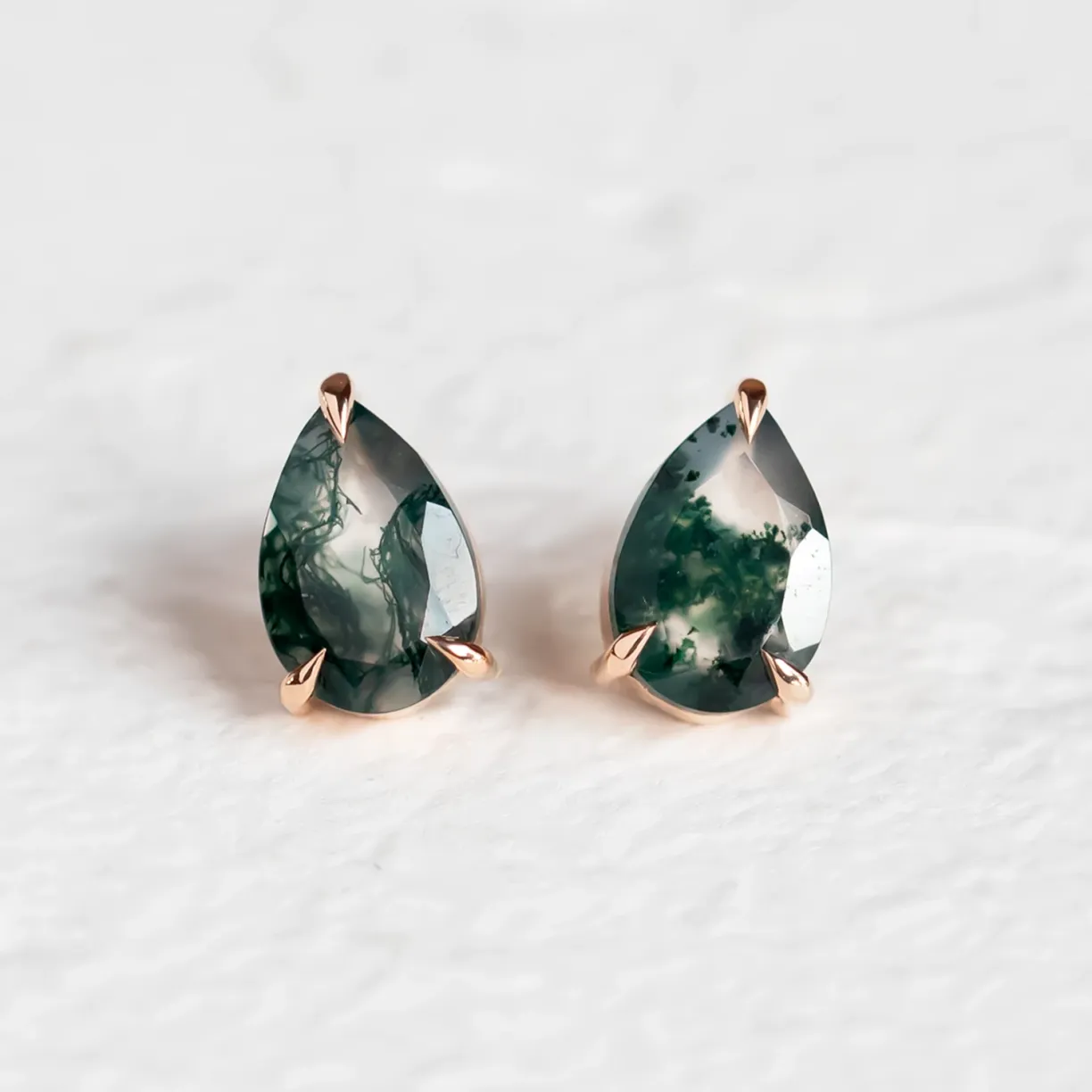 Gold pear moss agate earrings.