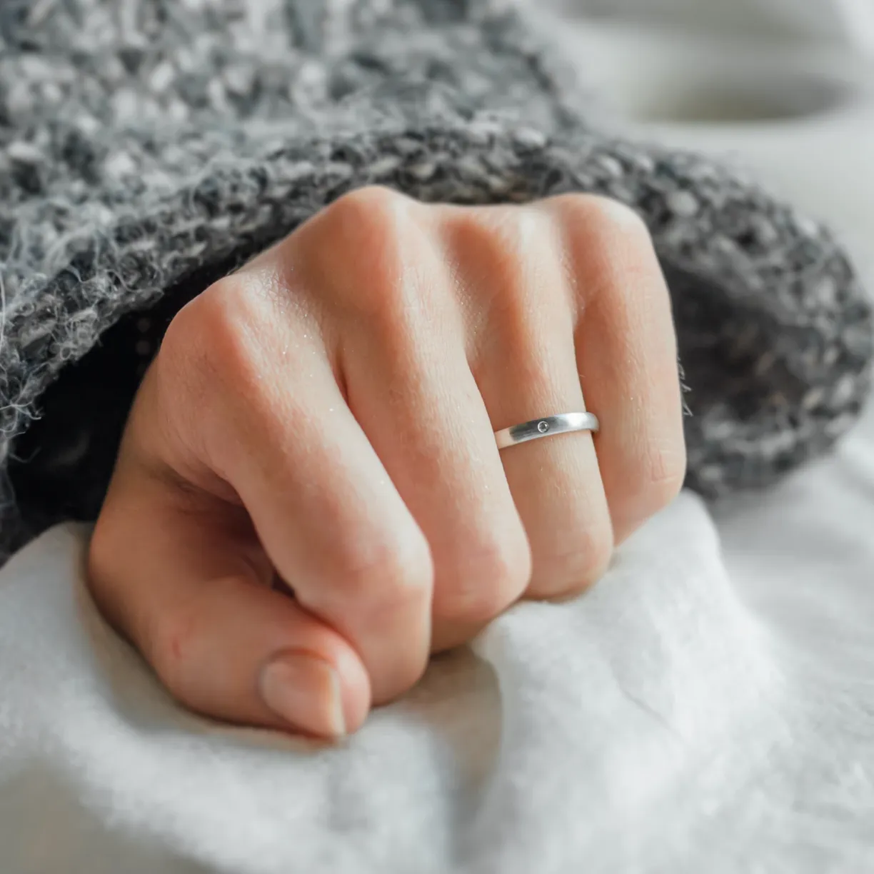 Solid matte wedding rings made of white gold with diamond.