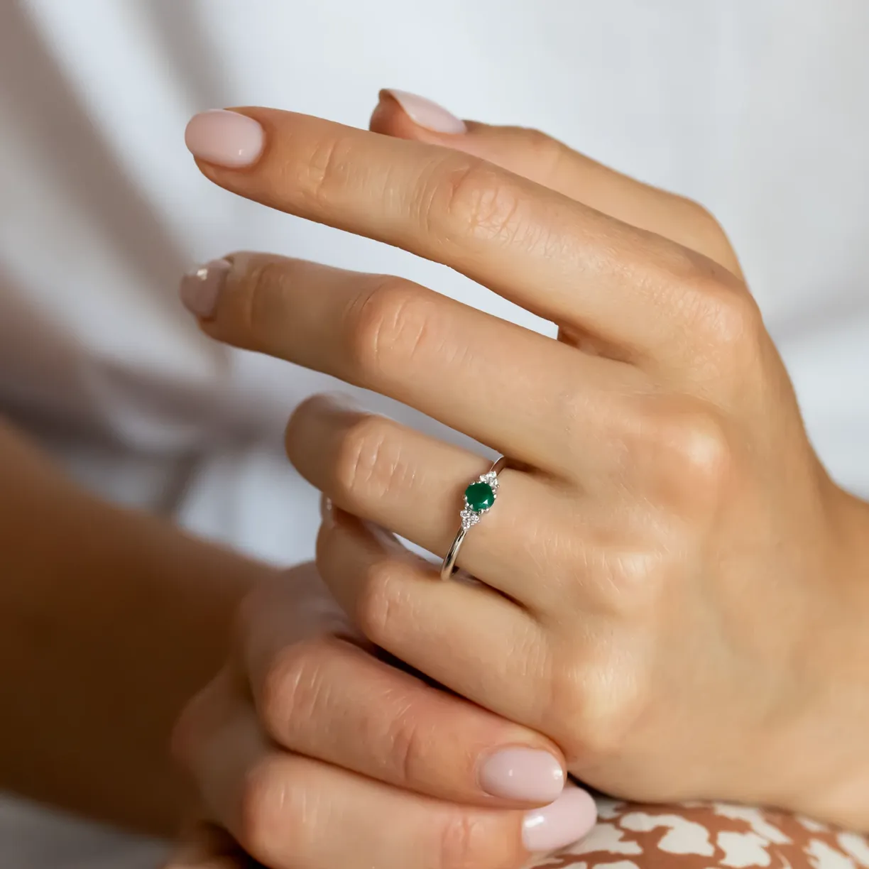 engagement emerald ring on hands