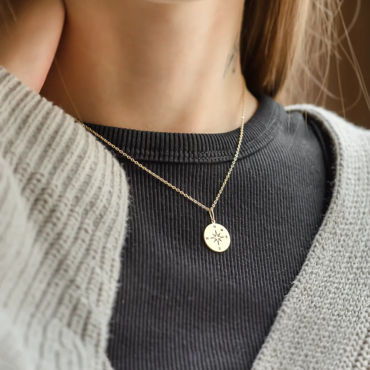 pendant with a compass