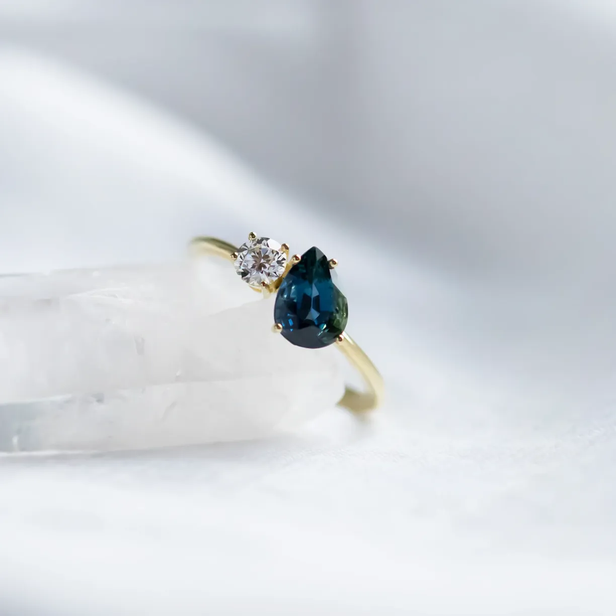 engagement ring with blue pear sapphire